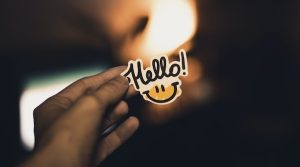 a sticker with hello and a smile